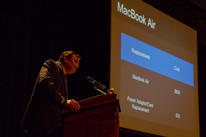 Principal John McKinney has delivered a brief presentation on the computers before students and parents pick them up.