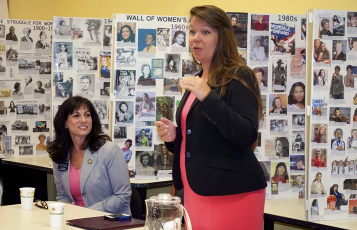 Rep. Melissa Rooker (L) listens to Rep. Stephanie Clayton at a session on women legislators this morning at the Corinth Library.