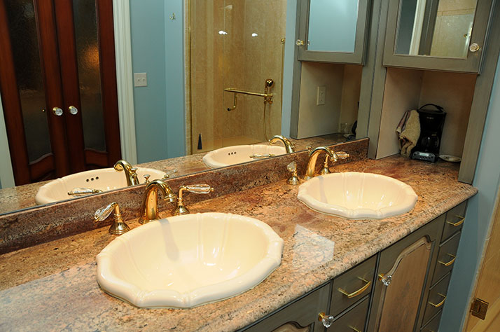 Granite with overmount sinks in Plaza condo.